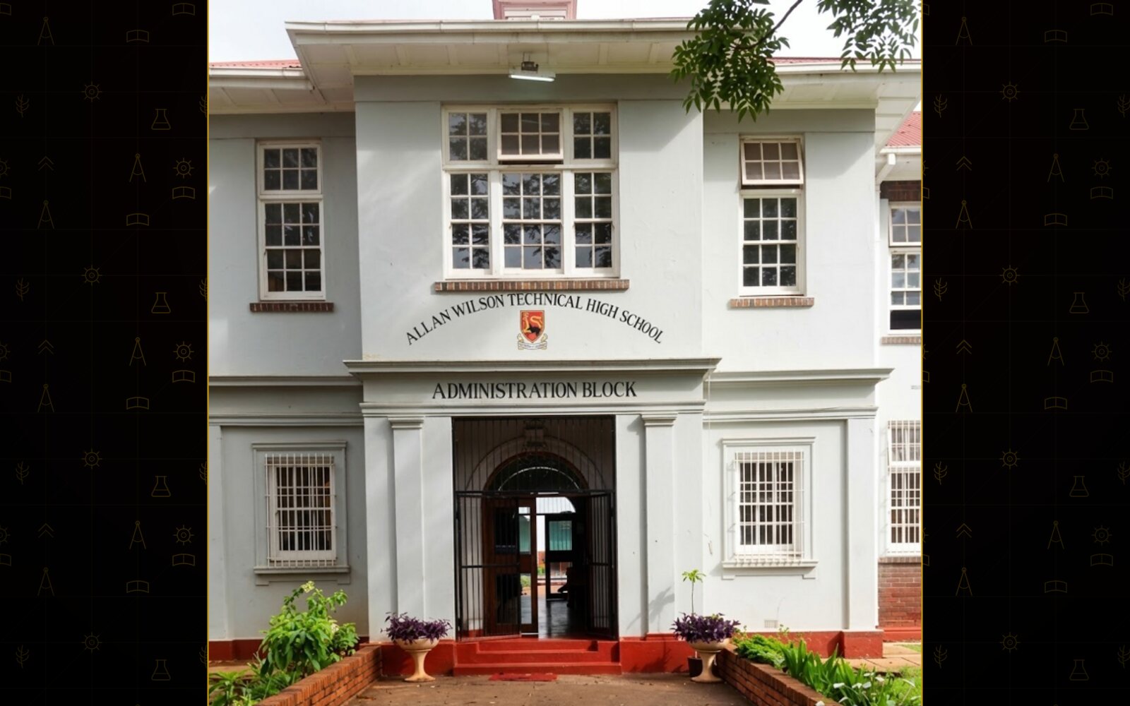 School name and Sable crest over the Administration Block doors.